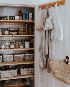 an organized pantry with baskets and other items