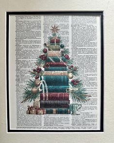 a christmas tree made out of books on top of a page in a book case