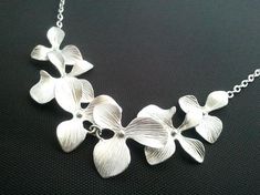 #jewelry #necklaces #beadednecklaces #orchidnecklace #flowernecklace #bridesmaidgifts #weddingjewelry #flowergirl #weddingnecklace #orchidearrings #rosegoldearrings #mothernecklace #sisternecklace #christmasgift #jewelry #necklace Delicate Flower Necklace For Wedding, Flower-shaped Necklace With Flower Decoration For Wedding, Silver Flower Necklace For Wedding, Floral Necklace For Wedding, Flower Shaped Necklace With Flower Decoration For Wedding, Silver Flower Bridal Necklace For Wedding, Flower-shaped Necklace For Wedding, Elegant Silver Flower Decoration Necklace, Elegant Silver Flower Necklace With Decoration