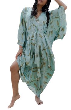 Perfect for poolside hangs or kicking it in the sand, this tie-front kaftan is the perfect accessory to add to your sun-loving wardrobe. V-neck Short sleeves 100% polyester satin Hand wash, line dry Imported Model stats: 5'10", 32" bust, 25" waist, 36" hip. Model is wearing size One Size. Bohemian Tie Waist Cover-up For Beach Season, V-neck Beach Dress With Tie Waist For Vacation, Flowy V-neck Kaftan For Day Out, Breezy Wrap Cover-up For Vacation, Beach Season Cover-up With Tie Waist, Flowy V-neck Beach Dress For Resort, Bohemian V-neck Tie Waist Cover-up, V-neck Swimwear With Tie Waist For Summer, Spring Beach Party Cover-up With Tie Waist