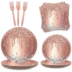 a set of pink and silver tableware with sequins