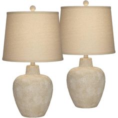 two white ceramic lamps with beige shades