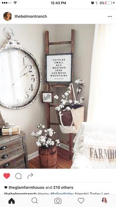 a room with a ladder, clock and flowers on the floor next to a window