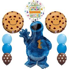 a blue cookie monster balloon and some balloons with the words happy birthday on it's face