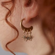 Get celestial guidance with the Star Multicharm Hoop Earrings, featuring a post-back golden hoop with dangling, crystal-detailed star charms. Celestial Earring Stack, Gold Celestial Jewelry, Celestial Gold Dangle Hoop Earrings, Celestial Metal Dangle Hoop Earrings, Celestial Style Metal Dangle Hoop Earrings, Gold Celestial Crystal Earrings With Moon Charm, Gold Celestial Crystal Earrings Nickel Free, Gold Celestial Crystal Earrings Nickel-free, Celestial Gold Crystal Earrings Nickel Free