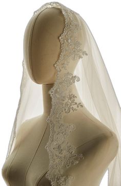 a mannequin with a veil on it's head