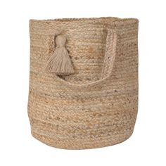 a large jute basket with a tasselled handle