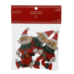 three small christmas ornaments in plastic packaging