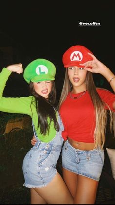 two young women wearing mario hats and overalls