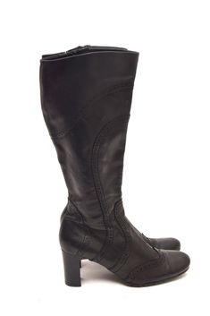 If you are looking for a pair of boots that are stylish, comfortable, and versatile, look no further than these vintage 90s pebbled leather tall boots. These boots are made of genuine leather that has a pebbled texture, giving them a unique and rugged appearance. The chunky heel is about 2.5 inches (6 cm) high, providing stability and support for your feet. The rounded toe shape is flattering and comfortable, and the shaft is about 13 inches (34 cm) high, reaching just below your knees. These bo Vintage Boots With Leather Sole And Square Toe, Retro Mid-calf Leather Boots With Round Toe, Retro Leather Mid-calf Boots With Round Toe, Retro Almond Toe Boots With Leather Sole, Vintage Boots With Reinforced Low Heel, Vintage Low Heel Boots With Reinforced Heel, Vintage Ankle Boots With Stacked Heel, Retro Leather Boots For Fall, Vintage Faux Leather Boots For Fall