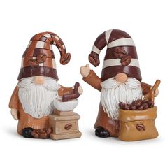 two brown and white gnome figurines sitting next to each other