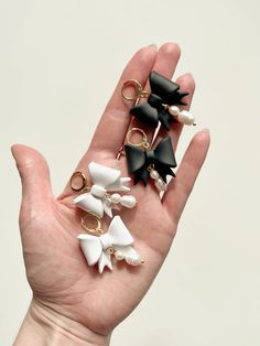 the hand is holding five different types of hair clips in it's palm,