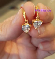 Solid 22k gold Dangling heart shape Cz stones earrings 916 Gold Metal Gold Purity : 916 GOLD Stones : cubic zirconia (CZ stones) Weight : 2.60-2.70 grams hallmark : 916 stamp Appx Size : see pic with ruler Colour : YELLOW gold Hallmark : Hallmarked 916 Design : Elegant & beautiful heart shape stones dangling earrings. Brandnew genuine authentic 22k solid gold / 916 gold 22k Gold Earrings, Stones Earrings, Coin Earrings, Solid Gold Earrings, Colour Yellow, Dangling Earrings, Beautiful Heart, 22k Gold, Cz Stone