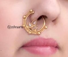 weight: 0.1 oz Height = 30 mm || Width = 25 mm Classic Nosering Antique Nose-Ring Indian Bridal Traditional One Gram Jewelry Indian Nose Ring does not require a hole in the nose. This Nose Ring is pressable (no piercing is required ) and worn on the left side .. Gorgeous 24 K gold plated. Handmade Indian Temple Jewelry, best to wear it for traditional ceremonies or Indian wedding. This bridal jewelry has ethnic finish. It has Cubic Zircon stones with ruby and emeralds. It is a Bollywood style on Nose Ring Indian Wedding, Maharashtrian Nath, Gold Nath, Marathi Nath, Nose Ring Indian, Nose Ring Gold, Ring Indian, Indian Nose Ring, Nose Piercing Jewelry