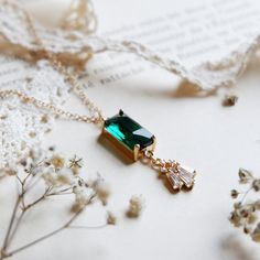 "This one and only Vintage Style Emerald Necklace is beautifully and uniquely designed by HelloArt Boutique. A rectangular baguette cut emerald necklace features a chain with pendant made of emerald gemstones cut in a rectangular, elongated shape known as a \"baguette\" cut. This type of necklace is known for its clean lines and geometric design, making it a stylish and sophisticated jewelry piece. The rectangular baguette cut emerald measures 22*8mm, combined with tiny transparent zircon pendan Emerald Stone Necklace, Emerald Velvet Dress, Chain With Pendant, Necklace Art Deco, Emerald Style, Sophisticated Jewelry, Necklace Art, Vintage Style Earrings, Art Deco Necklace