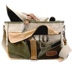 Upcycled messenger bag, German authenticity. Vintage Hobo Satchel For Travel, Vintage Khaki Satchel For Daily Use, Vintage Khaki Shoulder Bag For Everyday, Everyday Vintage Khaki Shoulder Bag, Vintage Khaki Satchel For Outdoor, Vintage Canvas Tote Bag With Pockets, Vintage Canvas Satchel For Outdoor, Vintage Canvas Satchel Travel Bag, Vintage Cotton Shoulder Bag