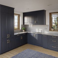 a kitchen with dark blue cabinets and white counter tops is pictured in this image from the front view