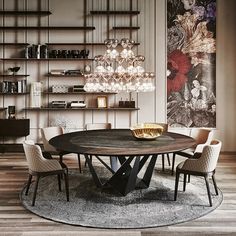 an elegant dining room with chandelier, chairs and a round table in the center