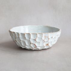 a white bowl sitting on top of a table