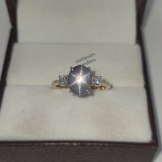 a ring in a box with diamonds on it