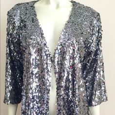 Gorgeous Gunmetal Silver Jacket Embellished With Paillette Sequins And 3/4” Sleeve. Fitted Silver Sequined Outerwear, Silver Sequined Outerwear For Evening, Silver Sequined Evening Outerwear, Silver Party Outerwear, Glamorous Silver Outerwear For Night Out, Elegant Silver Sequined Outerwear, Glamorous Fitted Silver Outerwear, Winter Silver Sequined Outerwear, Silver Sequined Winter Outerwear