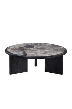 a black and white marble coffee table with an oval design on the top, sitting in front of a white background