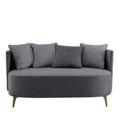 a gray couch with four pillows on it