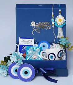 a blue gift box filled with assorted items