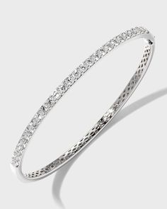 Diamond fashion bangle from Memoire..Polished 18-karat white gold hardware..26 round-cut, prong-set G-H/SI diamonds..Hinged opening with fold-over clasp..1.97 total diamond carat weight. White Gold Round Bangle For Everyday Luxury, Diamond White Diamond Bangle With Pave Setting, Luxury Brilliant Cut Bangle For Anniversary, Diamond Bangle In White Gold With Brilliant Cut, White Gold Diamond Bangle With Brilliant Cut, Everyday Luxury Diamond Bangle, Luxury Round Bangle With Pave Setting, Classic White Gold Bangle With Diamond Accents, Classic Round Bangle With Diamond Accents