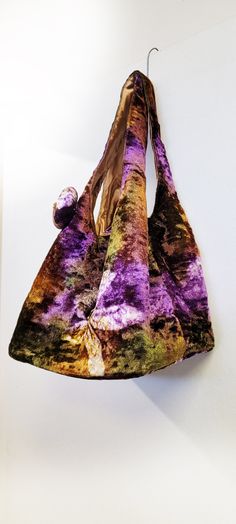 A hand made fine velvet hobo. tie and dye fabric. satin lining. dog hook and magnetic closure.  size 19x10x7 inches. broad base. light weight. zipper pocket. small removable broach. available in red black and blue Dog Hook, South Gate, Velvet Purse, Dye Fabric, Hobo Bags, Tie And Dye, Hobo Handbags, Magnetic Closure, Purses And Handbags