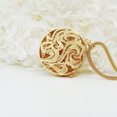 Inspired by Yun Boutique logo, this Auspicious Flower pendant embraced ancient Chinese filigree jinlay art with classic modern elegance. Adjustable chain can be styled with difference collar shapes. Not to be confused with regular gold plating, our vermeil is a thick layer of 18k solid gold on sterling silver. Chinese filigree inlay art is a delicate kind of jewelry metalwork, usually of twisted threads made of gold, silver, and copper, soldered together and arranged in artistic motifs with moun Luxury Metal Necklace With Detachable Pendant, Luxury Metal Necklaces With Detachable Pendant, Elegant Round Necklace With Detachable Pendant, Luxury Brass Necklace With Detachable Pendant, Elegant Brass Necklace With Intricate Design, Elegant Gold Medallion Locket Necklace, Elegant Gold Medallion Necklace With Locket, Gold Necklaces With Elegant Pendant Design, Elegant Ceremonial Metal Jewelry