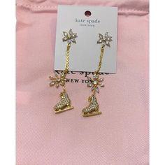 Kate Spade Snow Day Dangling Ice Skates And Snow Flakes Earrings Are A Stylish And Festive Addition To Any Holiday Outfit. The Earrings Feature A Snowflake Shape With Dangling Ice Skates, Made Of Metal With A Gold Finish And Cubic Zirconia Stones. They Have A Huggie Style Closure And Are Made In China. Snowflake Shape, Snow Flakes, Ice Skates, Holiday Outfit, Kate Spade Jewelry, Snow Day, Ice Skating, Holiday Outfits, Gold Finish