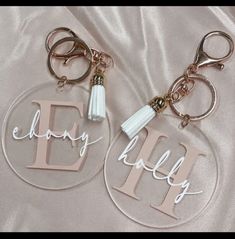 two personalized acrylic key chains with tassels