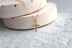 This minimal crucifix necklace is made of 14 karat gold filled.It's simple yet chic making it perfect as a baptism gift, holy communion or fashion accessory.All my pieces come boxed and ready for gift giving.Measurements:Pendant - 16mmWHAT IS GOLD FILLED?Gold filled material is solid gold bonded onto a base metal (copper). It contains 100 times more gold than gold plated jewellery. With daily wear your piece of jewellery can last up to 10 years! Rose gold filled is a great option for those with Minimalist Cross Jewelry For First Communion, Gold Minimalist Personalized Cross Necklace, Gold Personalized Minimalist Cross Necklace, Minimalist Personalized Gold Cross Necklace, Minimalist Cross Pendant Necklace For First Communion, Gold Cross Jewelry For Confirmation, Minimalist Cross Jewelry For Baptism, Minimalist Gold Jewelry For Baptism, Gold Crucifix Necklace