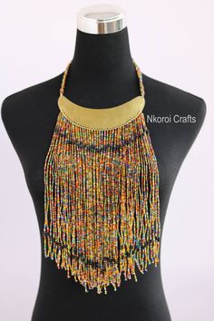 African beaded necklaces, African beaded jewelry, Beaded women jewelry, Christmas gift for her, Moms gift, Fringe necklace, Gift for her An elegant necklace that can match any outfit. Handmade by the Maasai women in Kenya using fine beads. Color: multicolor Available in different colors. 3-5 days delivery via DHL Express. Pay shipping fee for the first item only and additional items ship for free. To view more items in our shop, kindly click here: nkoroicrafts.etsy.com