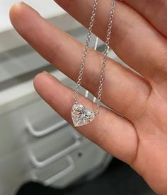 THE NECKLACE DISPLAYED IN THE PICTURES FEATURES A 3 CARAT LAB GROWN DIAMOND A heart-shaped diamond (or moissanite) necklace, featuring a minimalist design, epitomizes elegance through its simplicity. The diamond (or moissanite) delicately set without bezel takes center stage without distraction. The chains are available in different length ranging from 14 inches to 18 inches, available in 14K, 18K gold karats or sterling silver, and is available white, yellow, or rose color. You may also choose Luxury Heart Cut Brilliant Solitaire Necklace, Heart Shaped Diamond Necklace, Casual Necklaces, Heart Necklace Diamond, Moissanite Necklace, Heart Shaped Necklace, Diamond Necklaces, Necklace Display, Bezel Set Diamond