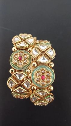 Openable Antique Round Kundan Meenakari Green Color Flower adorned Bangles/Handcrafted Rajwadi Style Gold Plated /Indian Bangles/ Antique Traditional Kada bangles handcrafted in Rajwadi Gold Polish. Sold as a pair. Ultimate gifting for loved ones. This is an intricately handcrafted and professionally designed by artisans who are skilled in manufacturing real gold & diamond jewelry, a very premium product Size 2.6 inches. Kada Bangles, Indian Bangles, Bangles Indian, Premium Product, Color Flower, Gold Diamond Jewelry, Gold Polish, Real Gold, Green Color