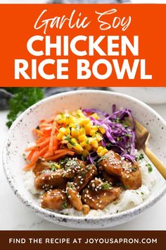 chicken rice bowl with carrots, corn and coleslaw in the background text reads garlic soy chicken rice bowl find the recipe at joyousapron com