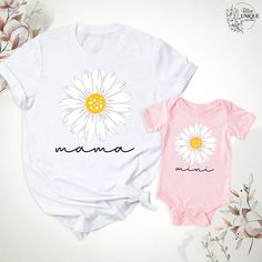 Daisy Mama Mini T-Shirt, Mama And Me Groovy Daisy Flower Shirt, Mom Baby Matching Birthday Party Shirts, Mama And Mini Tees, Mothers Day Tee. Hello, Welcome to Blue Unique Boutique, your destination for unique and handcrafted shirts! I'm Eve! I have been thinking about creating my business for a long time and now I have taken the first step towards it and it gives me excitement. As a small business, I take pride in creating unique designs from the comfort of our homes. Each shirt is carefully cr White Cartoon Print T-shirt For Spring, Family Matching White T-shirt With Cartoon Print, White Cotton Tops For Mother's Day, White Cotton Top For Mother's Day, Matching Funny Print Summer Tops, Graphic Print Tops For Birthday And Mother's Day, Graphic Tee Tops For Mother's Day Birthday, White Printed Tops As A Gift, White T-shirt With Letter Print For Mother's Day