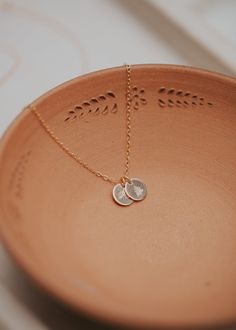 Our sweet, tiny dot stamped with one of our little symbol stamps and/or initials. A solid 9mm disc is hand-stamped and attached to a 16" or 18” delicate cable chain. Digits, Initials & Symbols available - see the photo chart. Available in 14kt Gold Fill + Sterling Silver. To ensure pendants remain on the delicate chain, pendants are intentionally designed to not slide on and off the chain. If you need assistance adding a pendant to a Tiny Dot Necklace you already own, please email us at hello@he Poppy Ring, Copper Uses, Everyday Wear Jewelry, Dot Necklace, Christmas 2022, Delicate Chain, Jewelry Cleaner, 14kt Gold, Chain Pendants