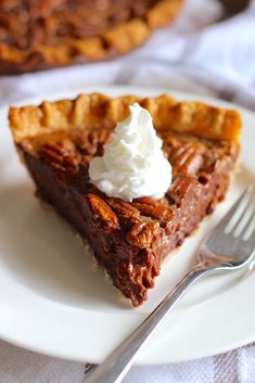 a piece of pecan pie with whipped cream on top