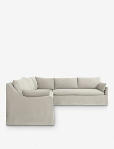 a large sectional couch sitting on top of a white floor