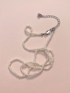 Editor's NotesANNAFLAIR1986's jewelry is feminine and perfect for daily wear.- Light-weighted- Eye-catching beads chain detail- Perfect for layering- Dainty and unique styleMeasurements(in.)- Size: 15.35in. (+1.97in. chain)- Beads: 0.08in.- Weight: 0.12oz.Composition & Care- Natural Pearl, Brass Chain- Avoid direct heat and moisture- Professional cleaning is recommendedDesigner- by ANNAFLAIR1986 Multi-strand Pearl Jewelry With Adjustable Chain, Pearl Chain Necklace With Round Beads, Pearl Beaded Necklaces With Delicate Chain, Pearl Beaded Chain Necklace, Pearl Beaded Necklace With Delicate Chain, Classic Adjustable Beaded Chain Jewelry, Silver Pearl Necklace With Adjustable Chain And Round Beads, Pearl White Beaded Chain Jewelry With Round Beads, Elegant Multi-strand Necklace With Tiny Beads