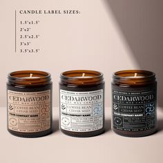 three candles sitting next to each other in front of a white background with the words cedarwood on it