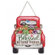 a red truck with a sign that says, blessed beyond words