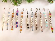 six pairs of personalized earrings hanging from a christmas tree