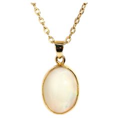 Crafted in 18 carat yellow gold, this adorable pendant features a lovely solid oval Australian crystal opal afire with alluring green and orange play of colour and set into an elegant milgrain rubover setting. Her name is The Cordy Pendant. She is threaded with an elegant cable chain and is ever-so-comfortable to wear, a perfect adornment fit for any time or place. The Cordy Pendant & Chain Gem Details The solid Australian white base opal display subdued flashes of orange and green play of colou Green Play, Australian Opal Pendant, Crystal Opal, Australian Opal, Opal Crystal, Opal Pendants, Vintage Jewellery, Free Jewelry, Cable Chain