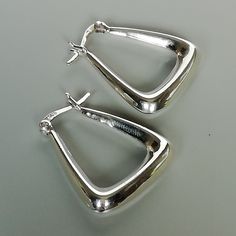 IMPORTANT **Please go through all the pictures i have posted for a listing with a ruler, on a model, on my hand, to get an exact idea of the actual size of the item. ONE PAIR of triangle sterling silver hoops. Dimensions: 22 x 25 x 5 mm. Weight: 5.6 gm These earrings are made of 925 hypoallergenic sterling silver. This piece is marked with 925 stamp for authenticity. Can be packaged in a gift box. I can include a personal message from you if needed You are welcome to contact me at... bhavnakwint Jewelry Lookbook, Skull Earrings, Jewelry Inspo, Toe Rings, Ear Jewelry, Silver Hoops