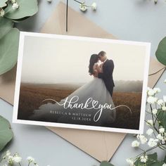 a wedding thank card with an image of a bride and groom kissing on the forehead