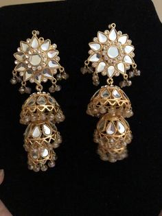 Elegant Kundan Jhumkas With Gota Work, Elegant Chandbali Jhumkas With Gota Work, Elegant Festive Jhumkas With Gota Work, Elegant Jhumkas With Gota Work For Diwali, Elegant Chandelier Earrings With Gota Work For Wedding, Elegant Chandbalis With Gota Work For Celebrations, Elegant Jhumkas With Gota Work For Parties, Elegant Chandbalis With Gota Work For Festive Occasions, Bollywood Style Round Tikka For Party